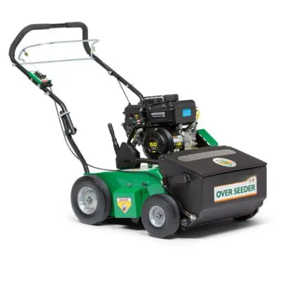 A green and black lawn mower with a power washer attached to the back.