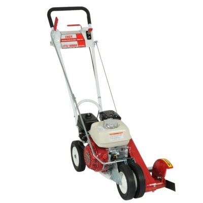 A red and white lawn mower is parked on the ground.