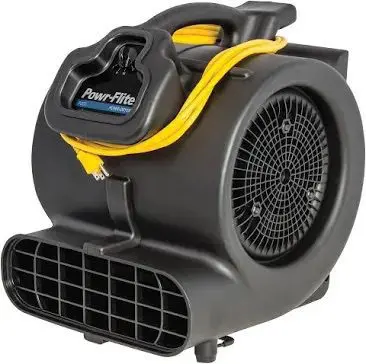A black and yellow air mover is on the floor.